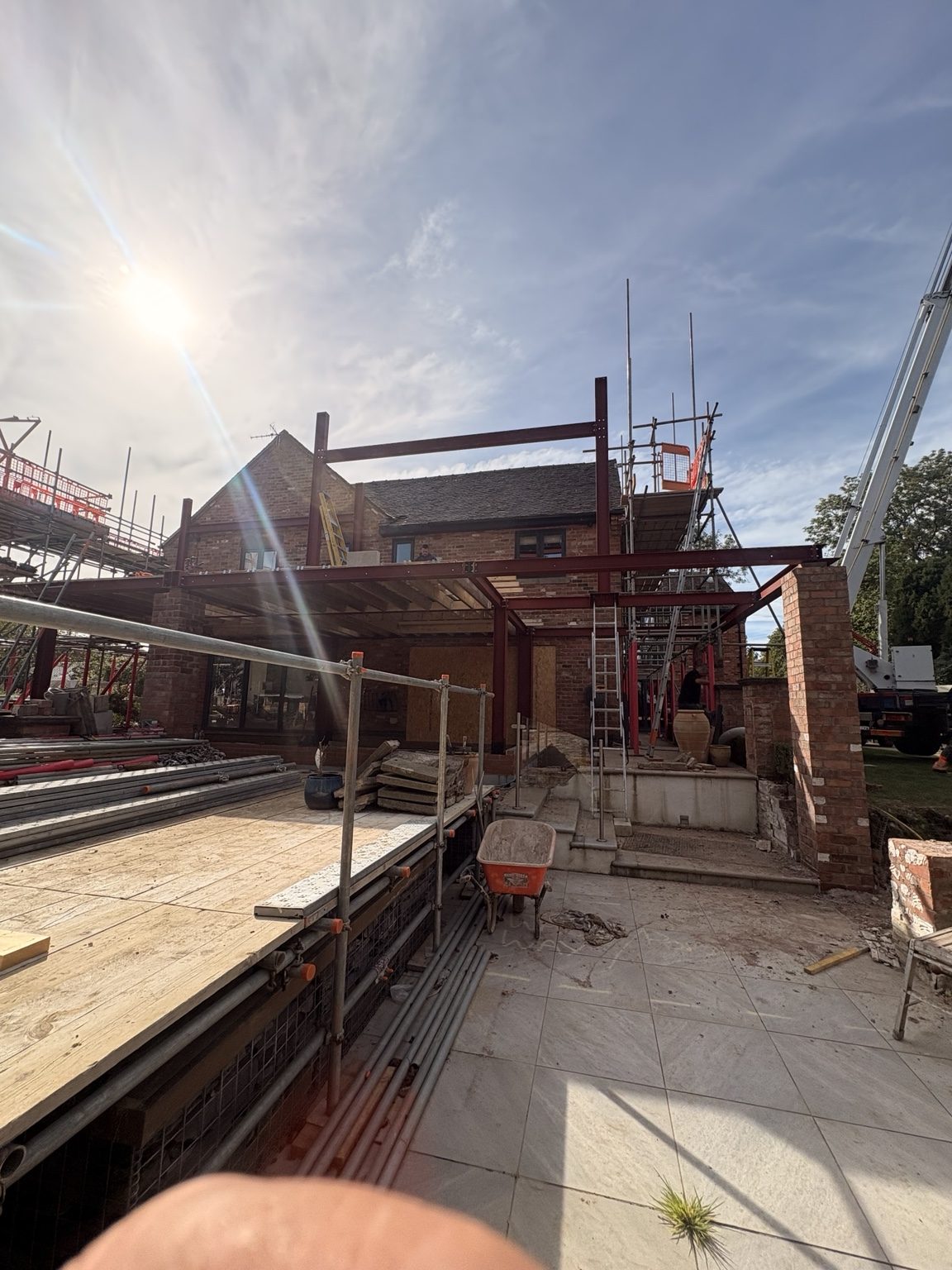 Wide view of new steel framework over kitchen extension at South View
