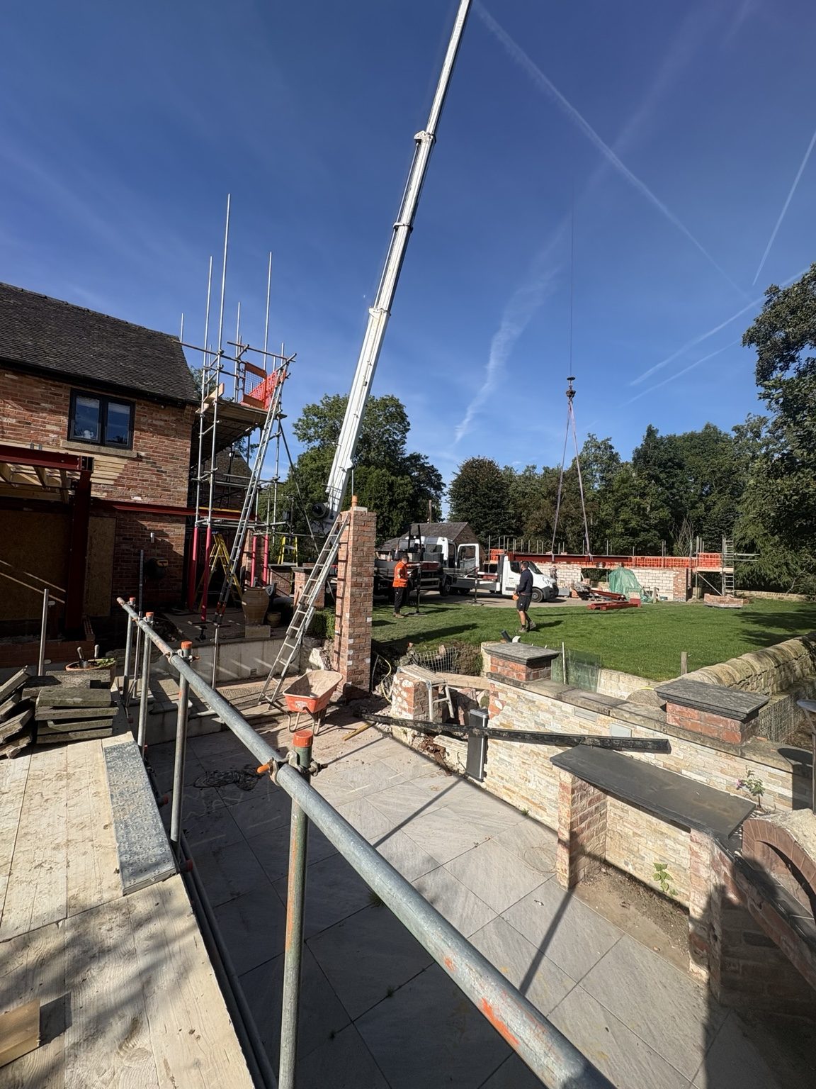 Crane working beside structural steelwork at South View project