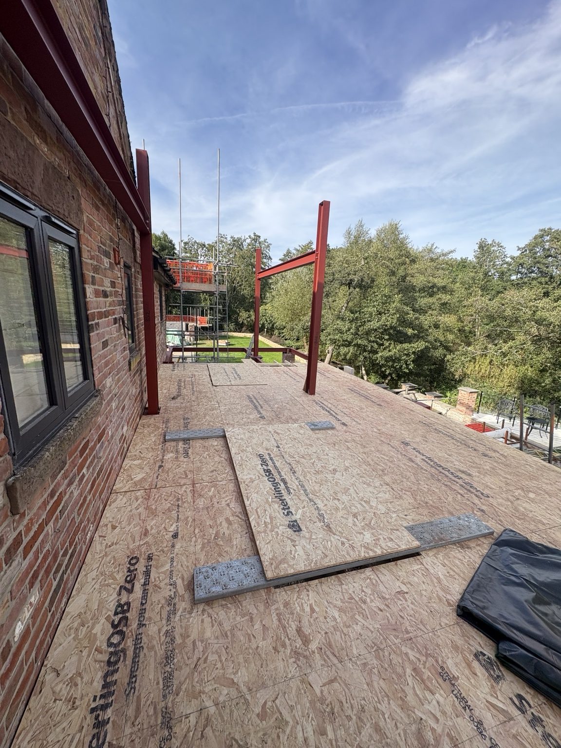 Timber balcony structural deck over first-floor steel frame at South View