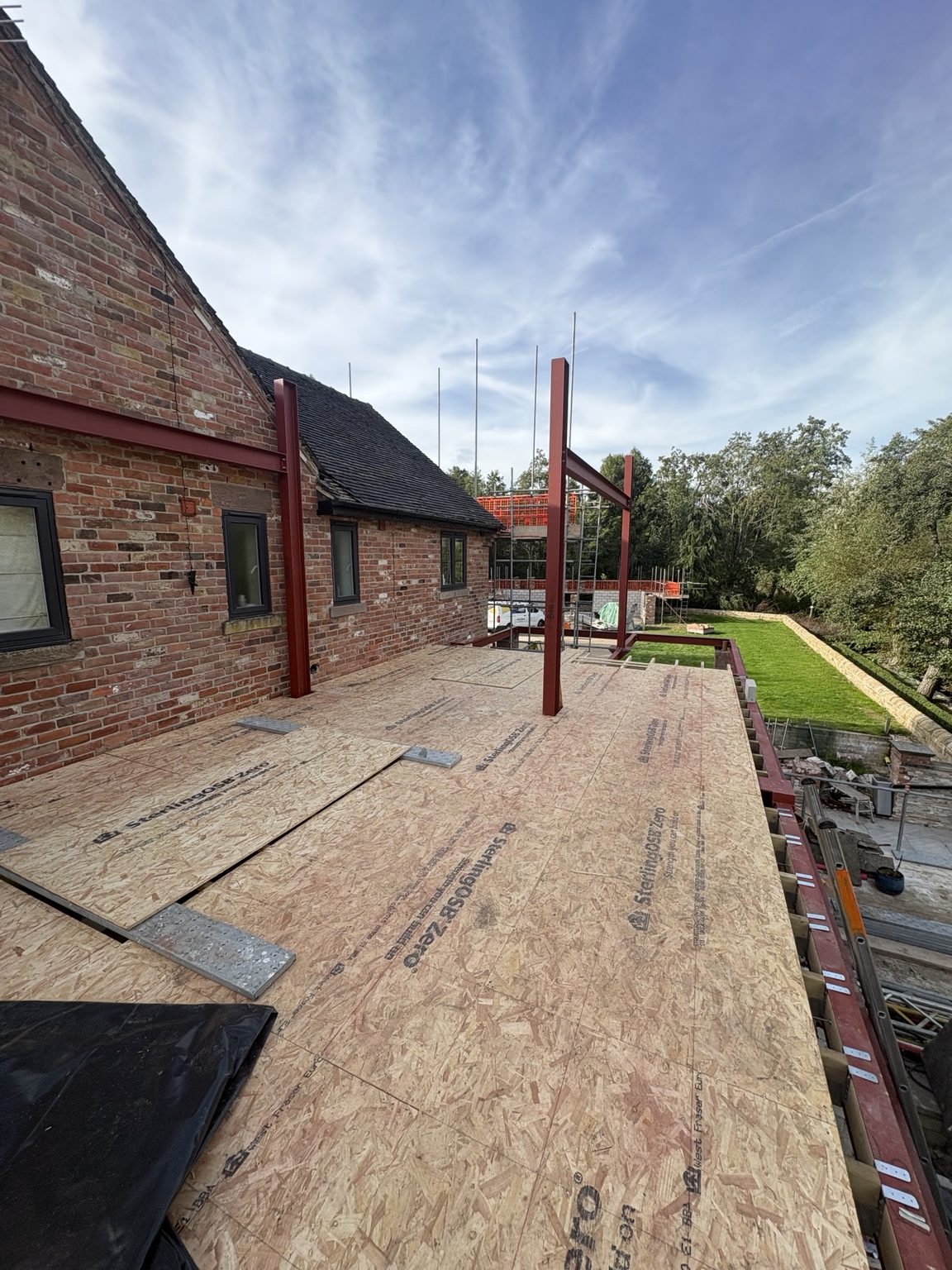 First-floor balcony decking with upright steel posts at South View