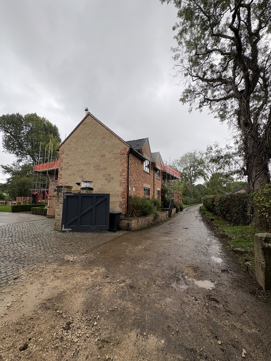 Existing South View house and access driveway with scaffolding