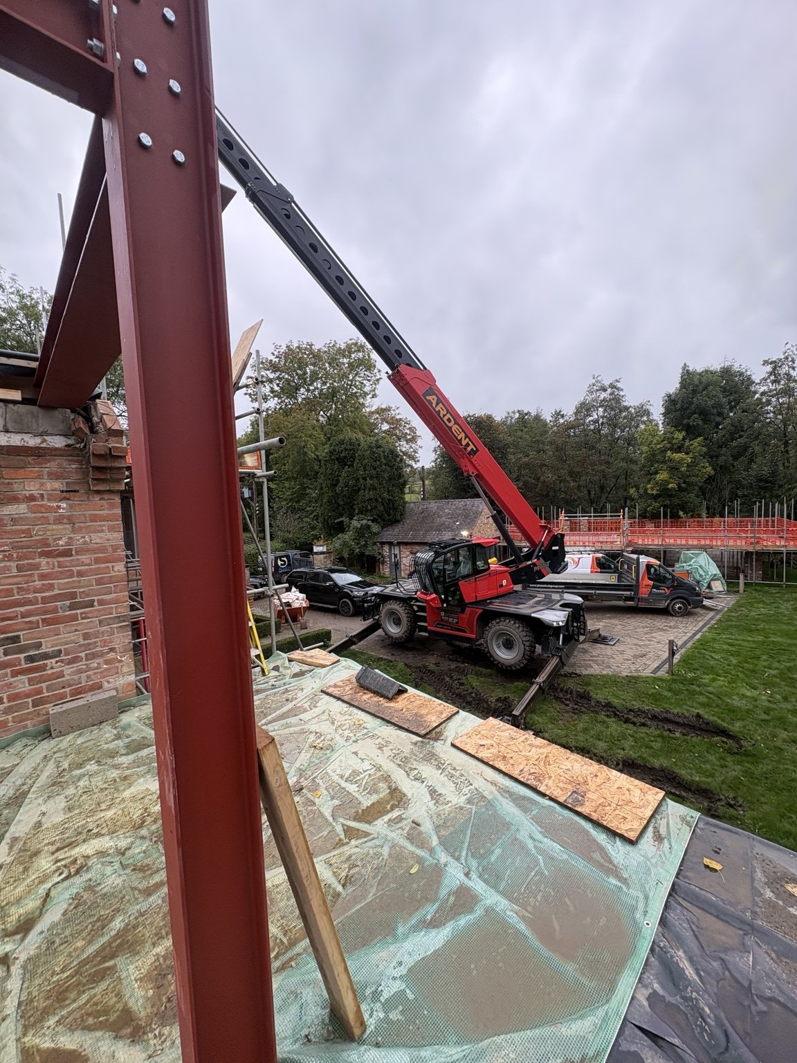 Structural steel frame and telehandler lifting equipment at South View